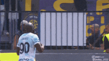 a soccer player wearing a number 90 jersey