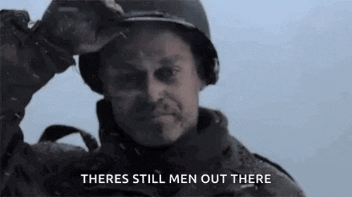 a man in a military uniform is holding his helmet over his head and says `` there 's still men out there '' .