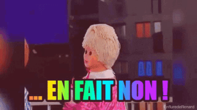 a rainbow colored sign that says " en fait non " on it