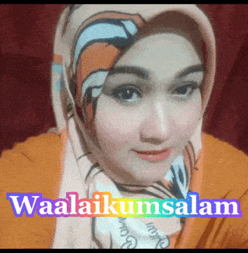 a woman wearing a scarf with the words waalaikumsalam on the bottom