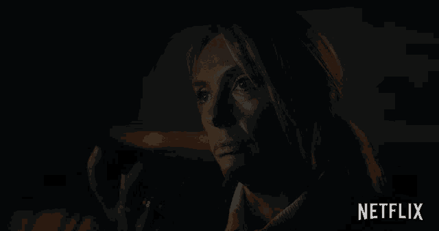 a woman sitting in a car with the word fine written on the bottom