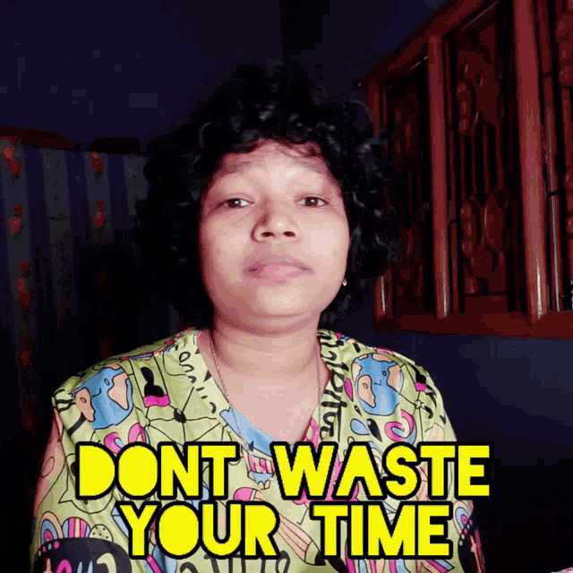 a woman in a colorful shirt says " dont waste your time " in yellow letters