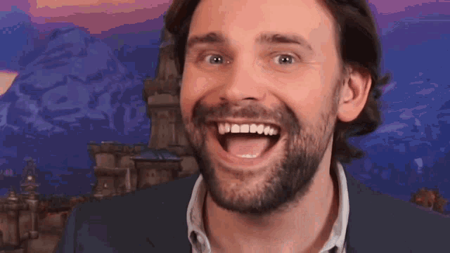a man with a beard is making a funny face with his mouth wide open