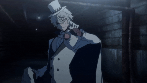 a man wearing a top hat and glasses is standing in the dark