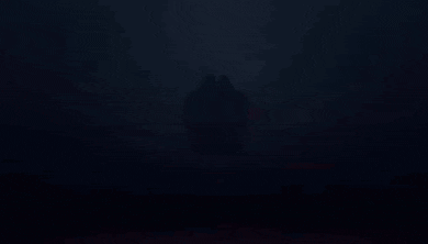 a red explosion with a black background and a few white clouds