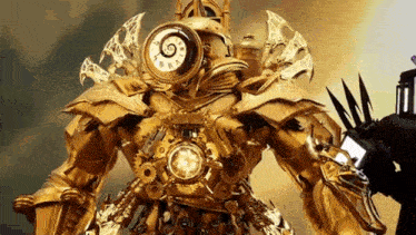 a gold robot with a clock on it 's chest is standing next to a man holding a torch .