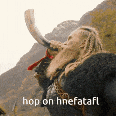 a man with a beard is blowing a horn with the words hop on hnefatafl below him