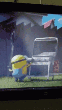 a tv screen shows two minions standing next to a table