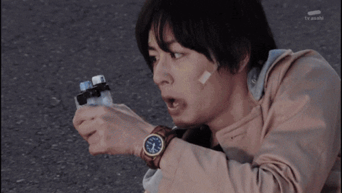 a man with a bandage on his forehead is holding a lighter and a watch that shows the time as 7:20