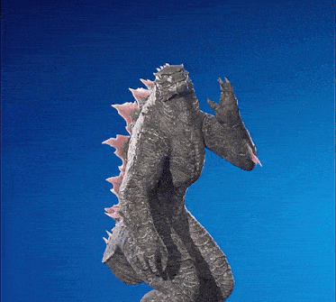 a statue of a monster with pink spikes on its back