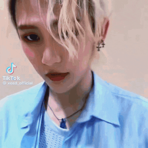 a close up of a person 's face with a tiktok watermark on the bottom