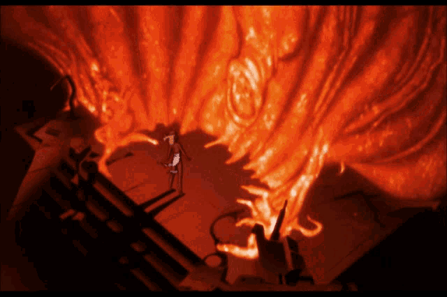 a group of people are standing in front of a large orange fire
