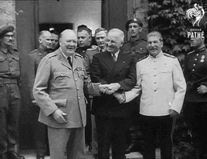 a group of men are shaking hands in front of a sign that says pathe on it