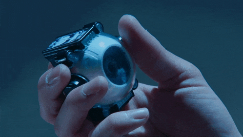 a person is holding a watch that has dg on it
