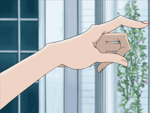 a person 's hand is pointing at something with their index finger