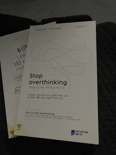 a book titled stop overthinking sits on a carpet