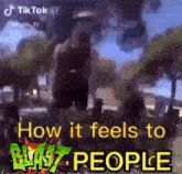 a picture of a person standing in a park with the words `` how it feels to blast people '' written on it .