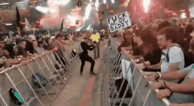 a man holding a sign that says fuck all of daddy