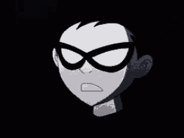 a close up of robin 's face with a black background .