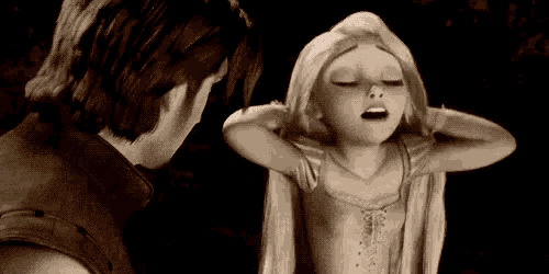 a man and a woman from tangled are standing next to each other .