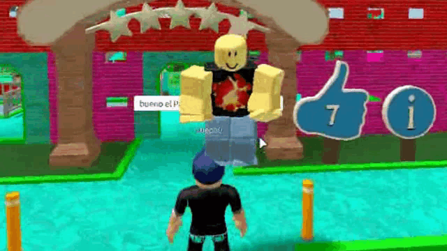 a man is standing in front of a building with a thumbs up sign .