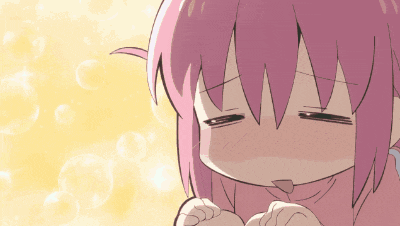 a girl with pink hair is making a funny face with her eyes closed