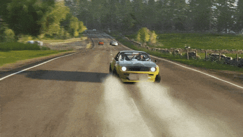 a yellow car is driving down a road with a sticker on the windshield that says gorilla drive