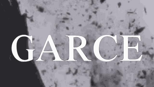 the word garce is written in white letters on a gray background