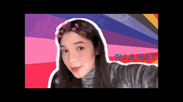 a pixel art of a girl with the name ella mae on the bottom