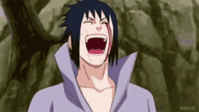 a man with blood on his face is laughing with his mouth open