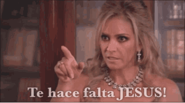 a woman is pointing at the camera with the words te hace falta jesus on the bottom