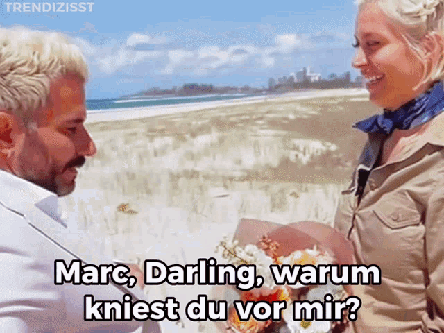 a man giving a woman a bouquet of flowers with the words marc darling warum kneest du vor mir