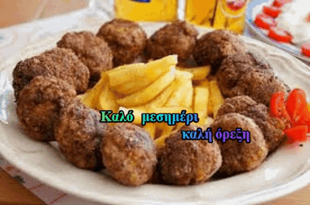 a plate of meatballs and french fries with a greeting in a foreign language