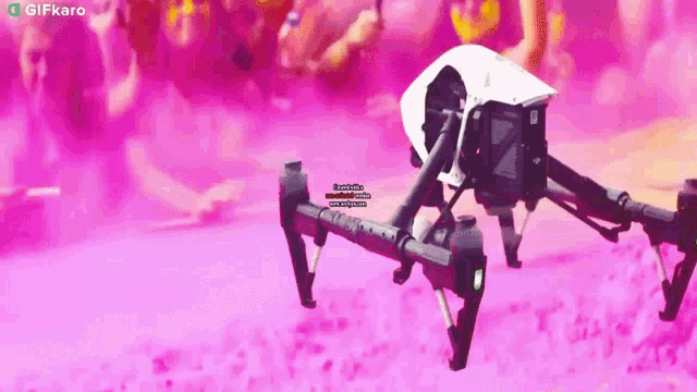 a gif of a drone flying in a pink sky