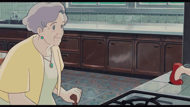 an elderly woman is standing in a kitchen holding a cane