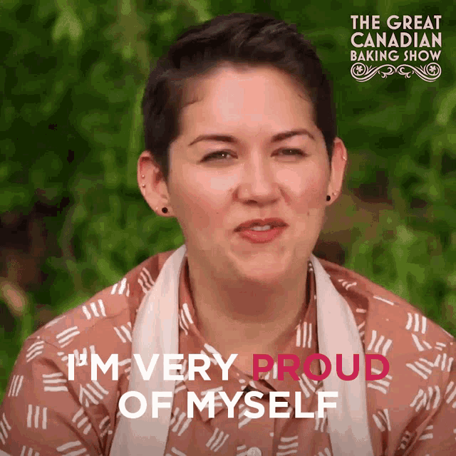 a woman says i 'm very proud of myself in front of a sign that says the great canadian baking show