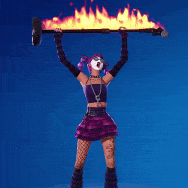 a woman in a purple dress is holding a stick with flames on it over her head