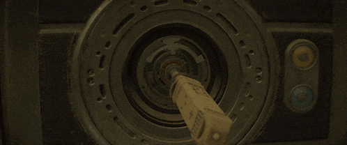 a close up of a circular object with a blue light in the center