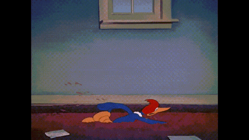 woody woodpecker is crawling on the floor in a cartoon