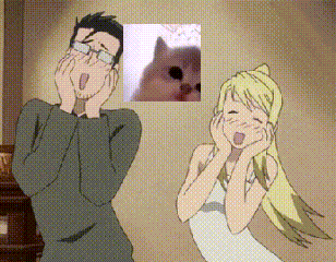 a man and a woman are standing next to each other with a picture of a cat behind them
