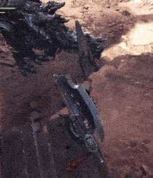 a sword is laying on the ground in front of a monster