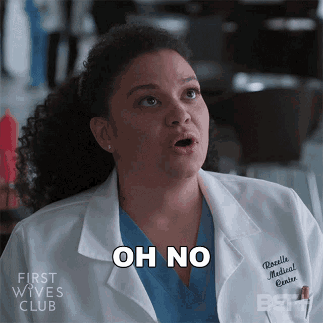 a woman in a lab coat with the words oh no on her chest