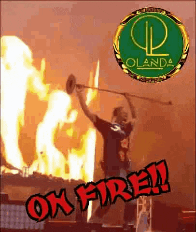 a man is playing a trumpet in front of a burning building with the words ok fire on the bottom .