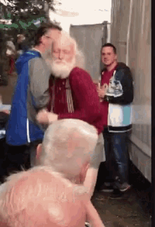 a man with a beard is standing in a crowd
