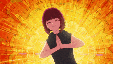 a girl in a black shirt is smiling with her hands together