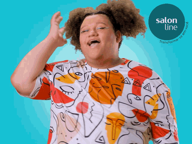 a woman with curly hair is wearing a shirt with faces on it
