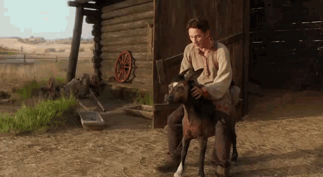 a man is sitting on a donkey in front of a log cabin .