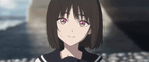 a girl with short hair and pink eyes is wearing a sailor uniform and smiling .