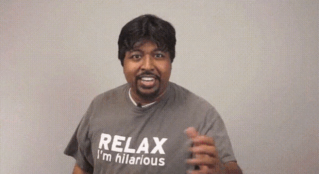 a man wearing a relax i 'm hilarious t-shirt