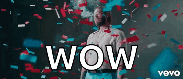 a man is surrounded by confetti and the words wow